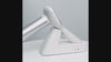 Product video showing the DrTono Vista Lite portable veterinary fundus camera from a side view on its charging base.